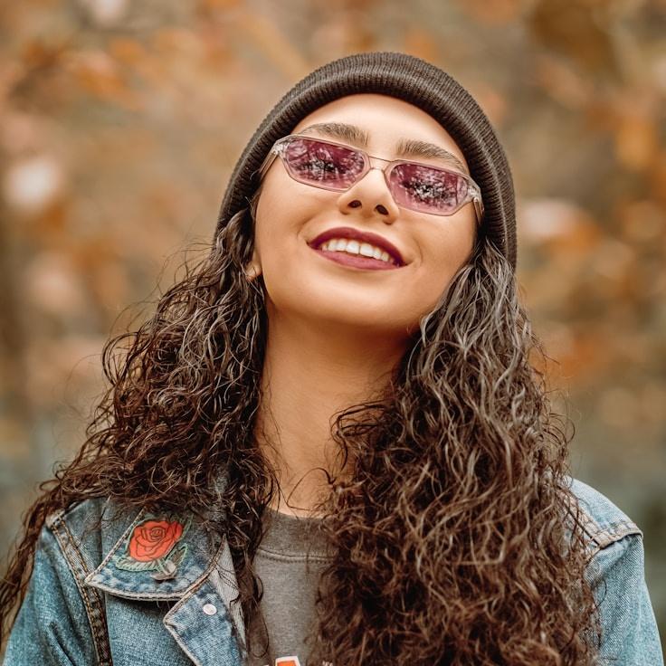 Alex M., Lead Design Curator at QuayBridgeGrove, reviewing corporate floral arrangements
